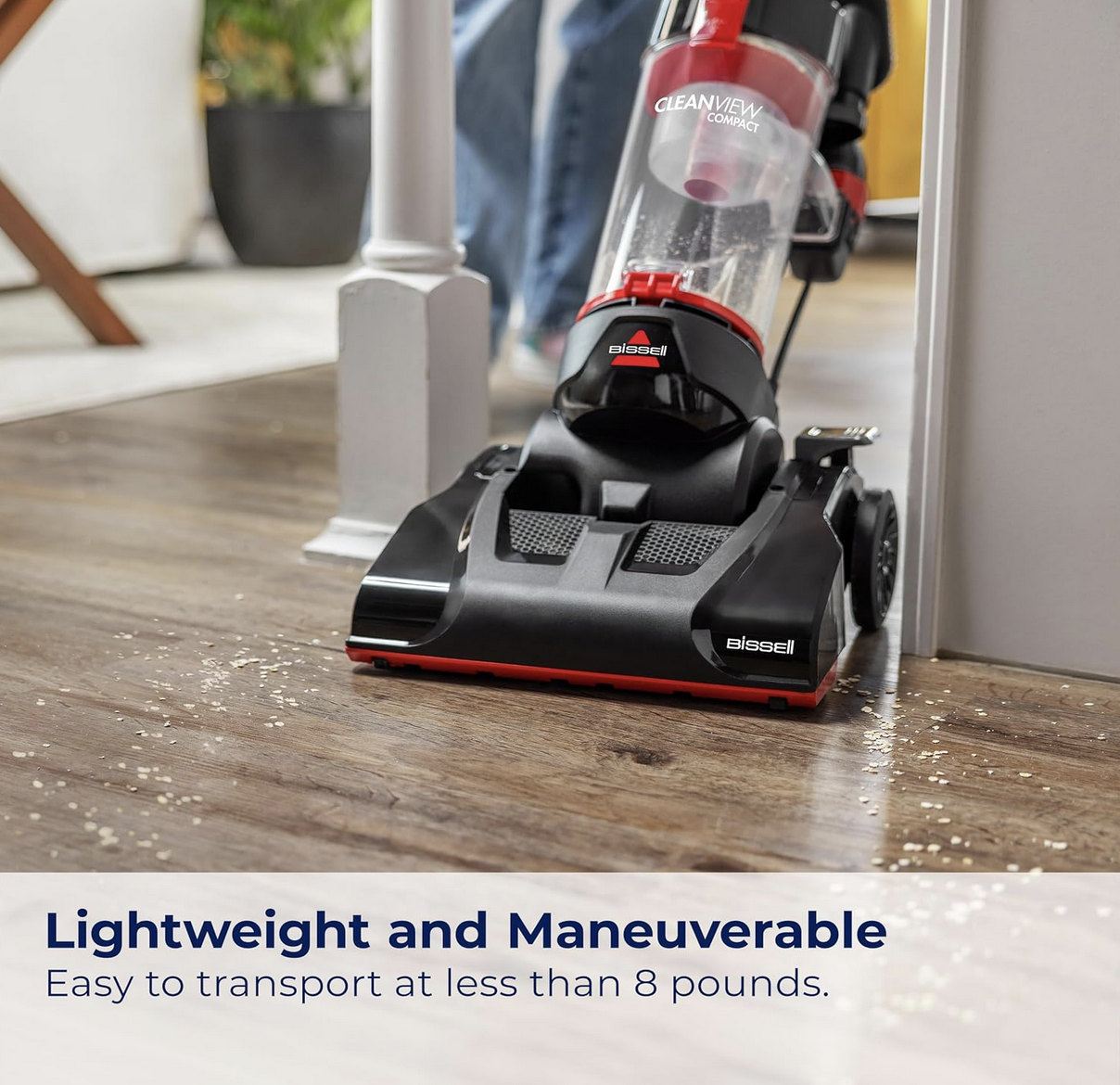 BISSELL CleanView Compact Upright Vacuum standing with cleaning attachments